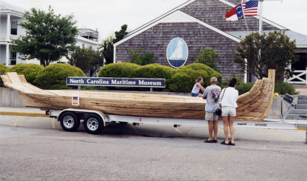 Wooden boat displayed outside the North Carolina Maritime Museum